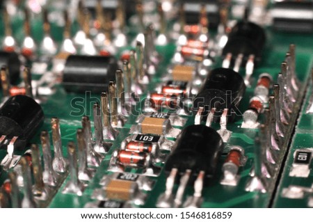 Close-up side view of a panel of SMD is located on the production of automatic control systems. The concept of industrial production of equipment for industrial and strategic purposes