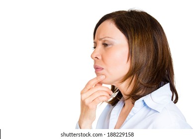 Closeup, Side View Portrait, Headshot, Middle Aged Woman, Hand On Chin, Daydreaming Something Serious, Upsetting, Isolated White Background. Human Facial Expressions, Emotions, Feelings, Reaction