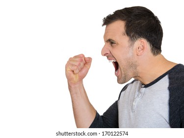 Closeup Side View Profile Portrait Of Angry Upset Young Man, Worker, Employee, Business Man Fists In Air, Open Mouth Yelling, Isolated On White Background. Negative  Emotion Facial Expression Emotion