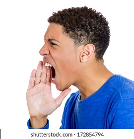Closeup side view profile portrait of angry upset young worker, employee, business man hand to open mouth yelling, isolated on white background. Negative emotion facial expression emotion conflict