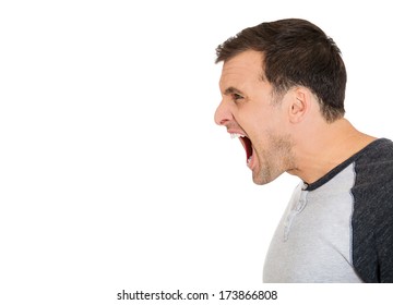 Closeup Side View Profile, Portrait Of Angry Upset, Mad Young Man, Worker, Business Employee, Wide Opened Mouth, Yelling, Isolated On White Background. Negative Emotions, Facial Expressions, Feelings