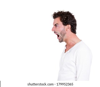 Closeup Side View Profile Portrait Of Angry Upset Young Man, Worker, Employee, Business Man With Wide Open Mouth, Yelling Isolated On White Background. Negative Emotions, Facial Expressions, Reaction