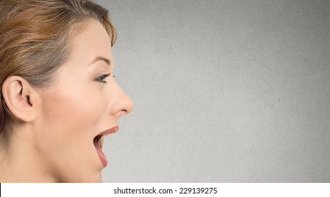 Closeup Side View Profile Portrait Headshot Woman Talking With Sound Coming Out Of Her Open Mouth Isolated Grey Wall Background With Copyspace. Human Face Expression. Communication Information Concept