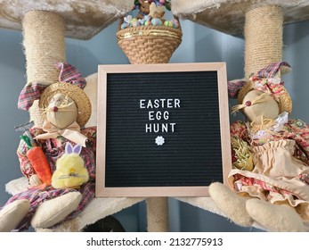 A Closeup Of A Sign Saying Easter Egg Hunt With Easter Decorations Around It.