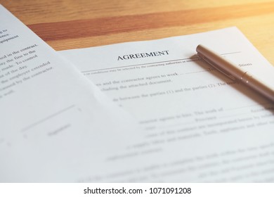 closeup of signing a documentation agreement and pen on the table. - Shutterstock ID 1071091208