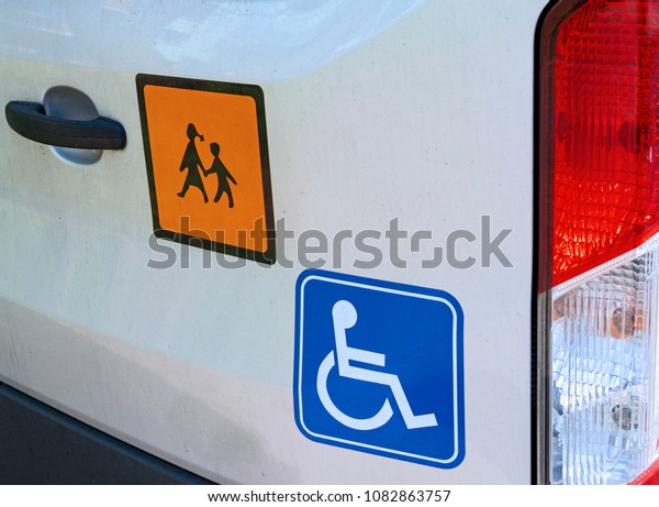 Close-up of signs on a school bus for handicapped\
children in Germany