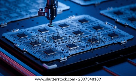 Close-up of Silicon Dies Attached to Substrate on During Computer Chip Manufacturing at a Fab. Microchip Production and Packaging Process at a Semiconductor Factory.
