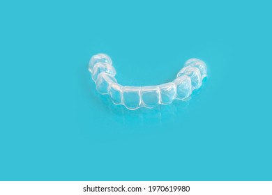 Close-up Of Silicone Night Mouth Guard For Teeth Clenching Grinding Dental Bite Sleep Aid On A Blue Background, Concept Dental Services, Remedy For Grinding Teeth, Oral Care