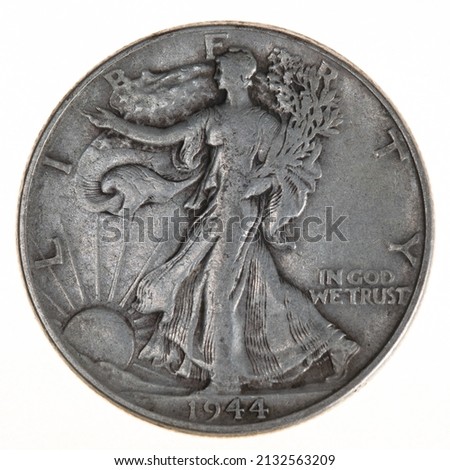 Close-up of a silver 1944 American Walking Liberty Half Dollar
