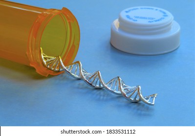 Closeup of a  silver DNA strand spilling out of an orange prescription bottle on a blue background. - Shutterstock ID 1833531112