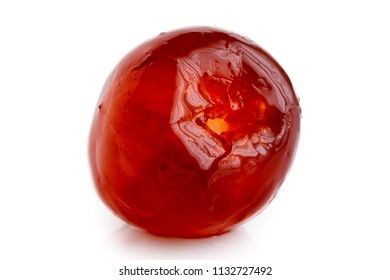 Closeup Of A Single Red Glace Cherry Isolated On White.