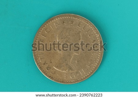 Closeup of a Six Pence coin of Great Britain depicting Queen Elizabeth II on one side.