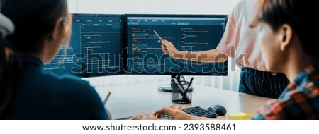 Closeup skilled young female programer present program coding and sharing programing idea while manager listening carefully.at modern office company. Java script, web design concept. Burgeoning.