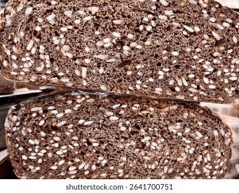 Close-up of sliced multigrain bread from a local farmers market in Bialystok, rich in seeds and natural texture.