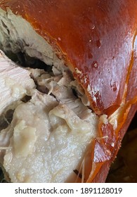 A Close-up Of Sliced Pork Lechon