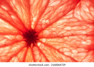 Close-up of sliced ripe grapefruit, macro, creative background. - Shutterstock ID 2160064729