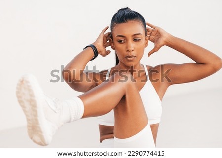Close-up of slim female doing bicycle crunches. Fitness woman practicing abs exercises.