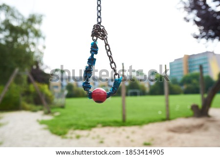 Closeup of a small cable swing at a park playground for children