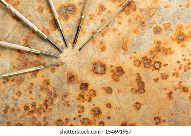 closeup small screwdriver on rusty steel