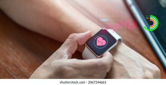 Close-up of a smart watch health tracker with the heart rate shown on the screen. Modern stylish and innovation wearable device