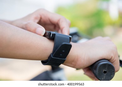 Close-up smart watch on arm women to ride a bicycle - Shutterstock ID 400199563