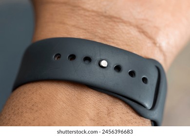 Close-up of a smartwatch band on a wrist - Powered by Shutterstock