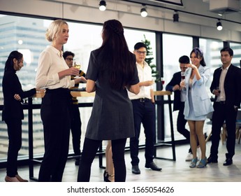 Close-up Smiling Businesspeople On New Year Party In Office And Celebrating Of New Year Small Group.