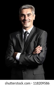 Closeup Of A Smiling Senior Man Isolated Over Black Background