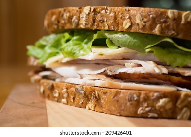 Closeup Of A Smoked Turkey And Cheese Sandwich.