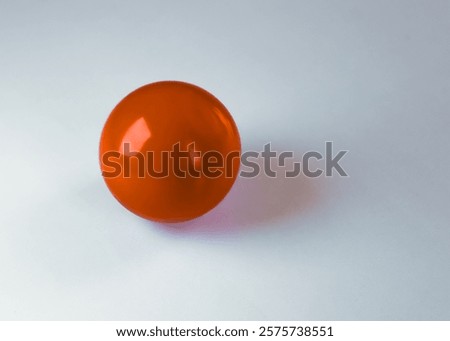 close-up of a smooth solid shiny red glossy ball isolated on a white background. icon symbol lifestyles recreation meaning metaphor graphic art element