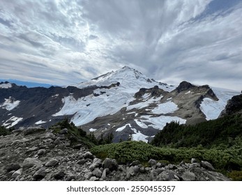 Closeup of snow covered mountain with clouds - Powered by Shutterstock