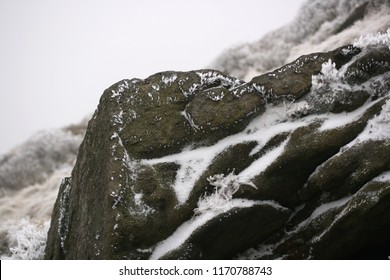 Close-up Of Snow And Ice On A Rock.