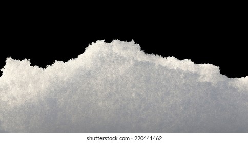 Closeup Of Snowbank Isolated On Black 