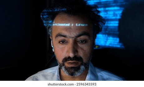 Close-up of a software developer with a masked face. Screen light and computer code reflected in his face. System administrator. Concept of cybersecurity and hacking.
