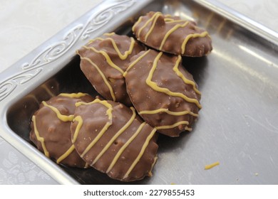 Close-up of some chocolate biscuits in a tray