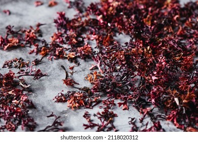 closeup of some dried irish moss leaves on gray stone surface