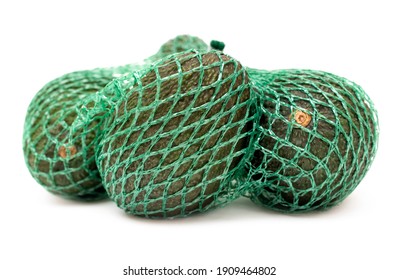 Close-up of some organic hass avocado fruits in a green mesh bag isolated on a neutral background.