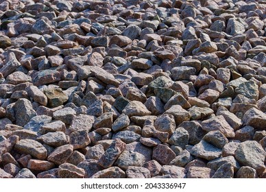 Close-up Of Some Red Granite Track Ballast In The Sunshine