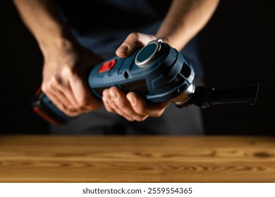 Closeup of someone skillfully using a handheld electric vibro Multi Cutter tool for various DIY tasks and projects
