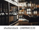 Close-Up of Sommelier Tasting White Wine in Dimly Lit Cellar