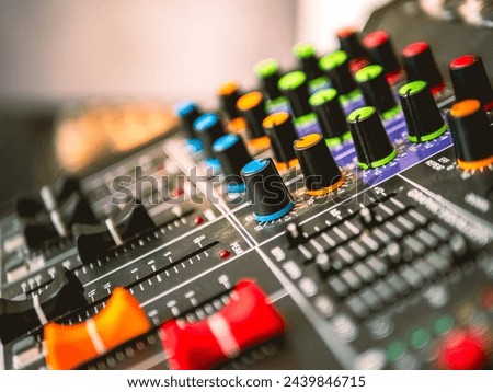 Close-up of sound recording equipment knobs.Mixer control. Music engineer. Backstage controls on an audio mixer, Sound mixer. Professional audio mixing console, buttons, faders and sliders. 