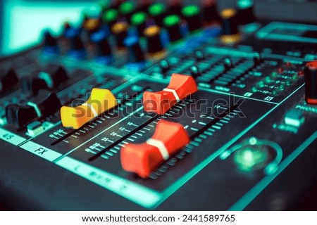 Close-up of sound recording equipment knobs.Mixer control. Music engineer. Backstage controls on an audio mixer, Sound mixer. Professional audio mixing console, buttons, faders and sliders.