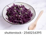 A close-up of sour, fermented red cabbage, probiotic-rich fermented food for promoting a healthy digestive system and nutritious eating habits.