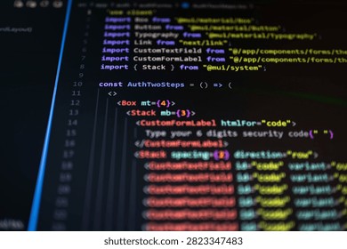 Close-up of source code displayed on a computer monitor with colorful syntax highlighting and shallow depth of field, representing software development, web programming, cybersecurity, authentication, coding and digital technology.