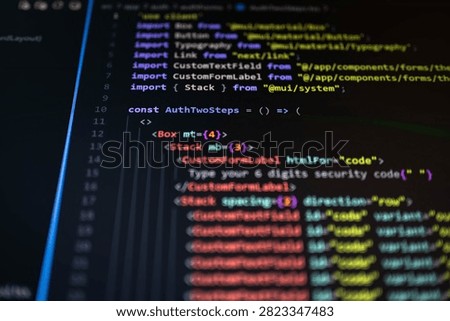 Close-up of source code displayed on a computer monitor with colorful syntax highlighting and shallow depth of field, representing software development, web programming, cybersecurity, authentication, coding and digital technology.
