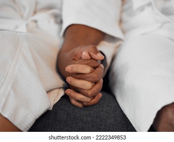 Closeup Spa Couple, Holding Hands And Relax In Bathrobe Together At Luxury Resort For Wellness Treatment. Black Couple Sofa, Support Trust Love And Rest For Health, Care And Calm For Physical Therapy