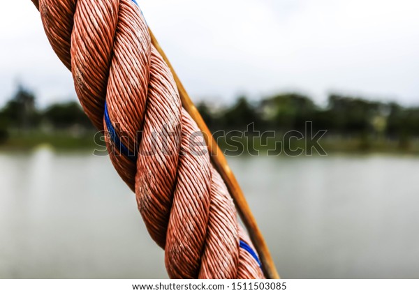Close-up of a special rope used to pull a\
medium-sized suspension\
bridge