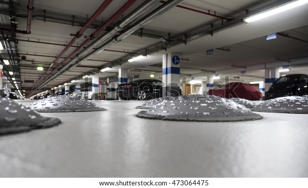 Close-up of speed bumps in a parking garage,\
selective focus