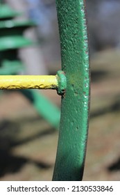 Closeup Of A Spoke And Wheel Connection On A Vintage Farm Tractor.