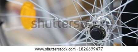 Close-up of spokes on clean shiny bicycle standing outside on street. Part of bike. Detail or component of transportation. Vehicle and transport concept